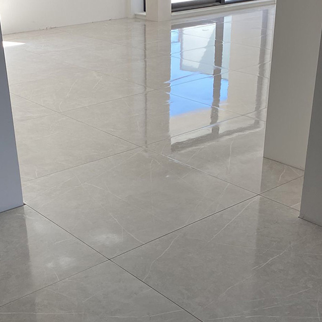 Luxury 120x120 tiled floor in The Mayor Amstelveen living room, freshly installed and polished after grouting by VDB Tegelwerk